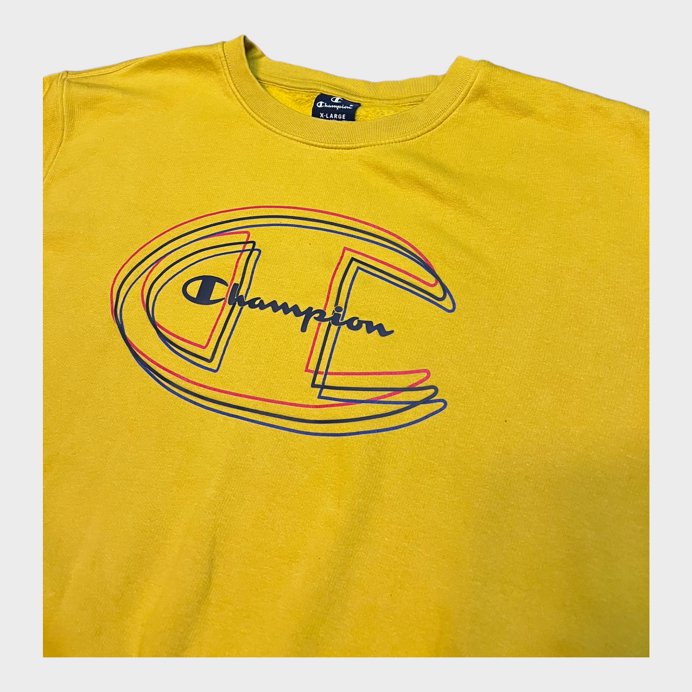 Cloe-up of the Champion varsity sweatshirt in bright yellow