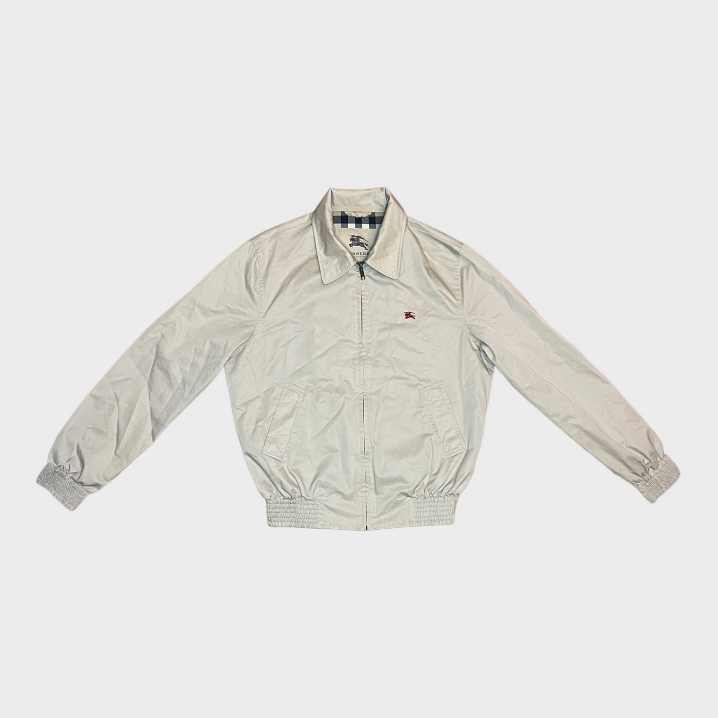 Front of the BURBERRY Short Jacket in an light cream white color.