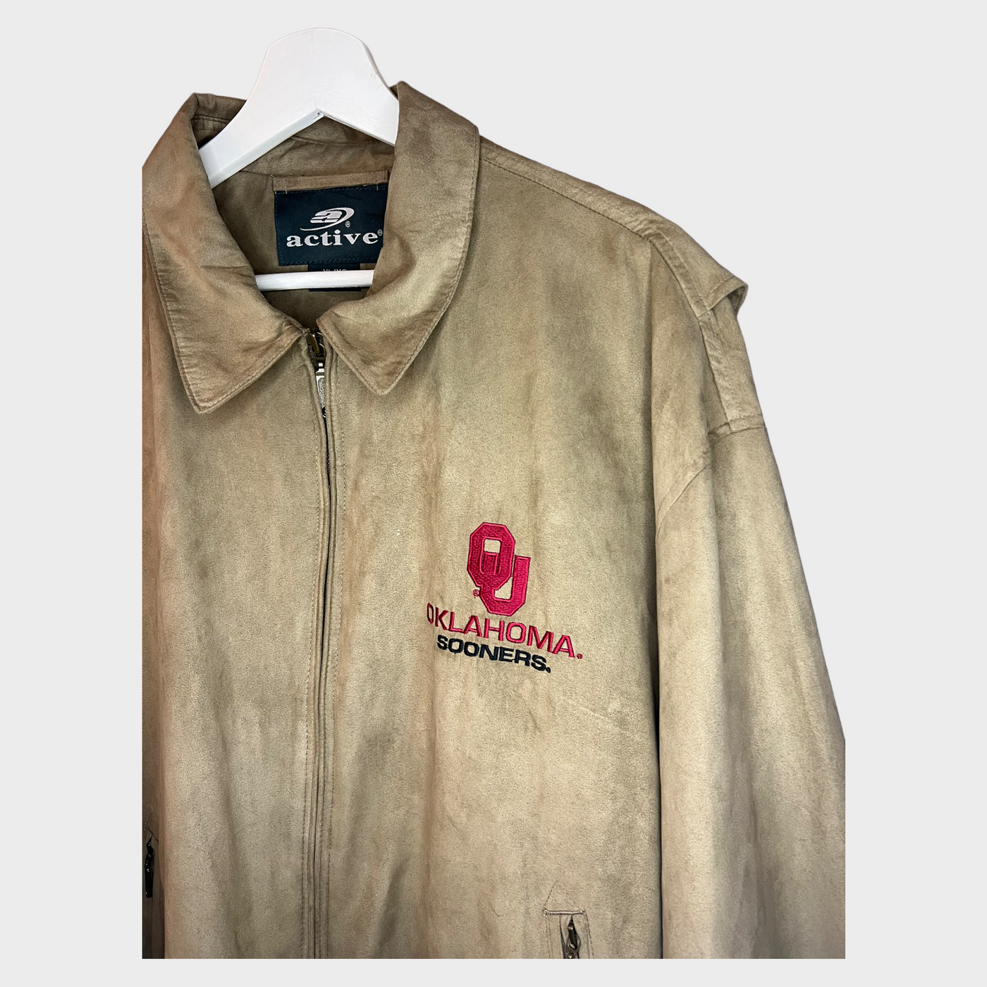 Close-up of the Oklahoma University Suede Worker Jacket with a spread collar.